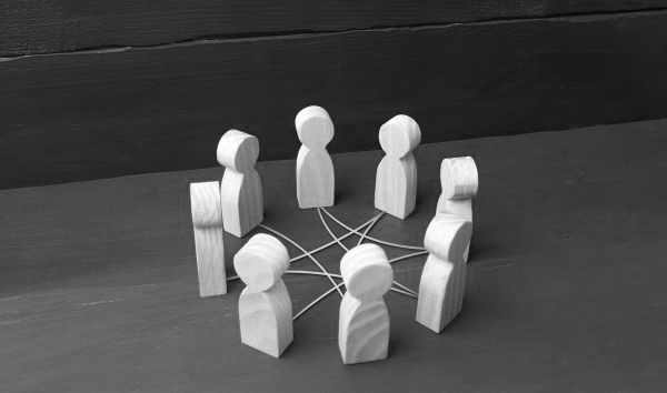 circle of wooden people